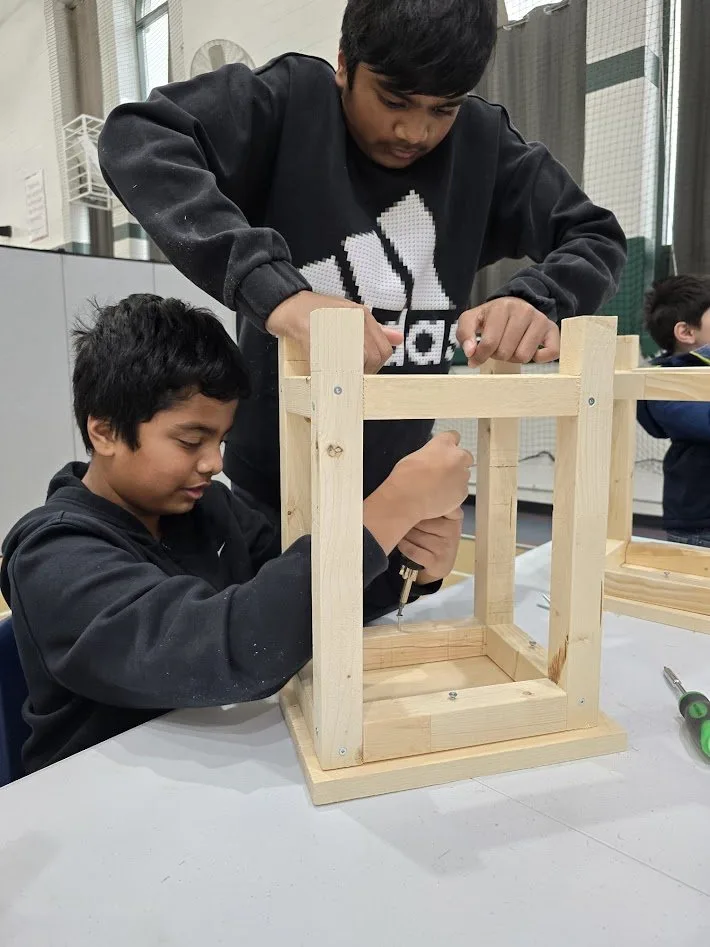 Children working together on a STEM building project